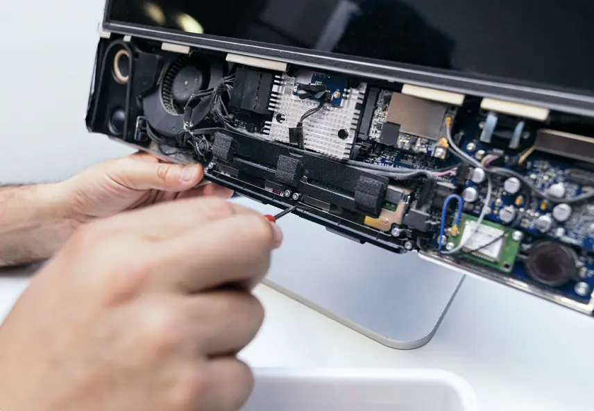 Technician using tools repairing computer laptop